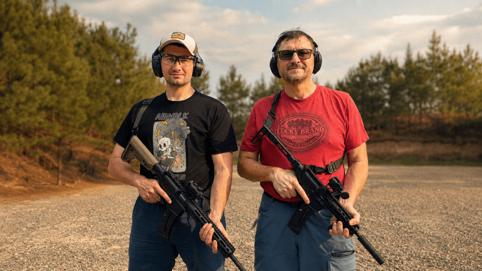 Mikhail coaching a student at an outdoor range.